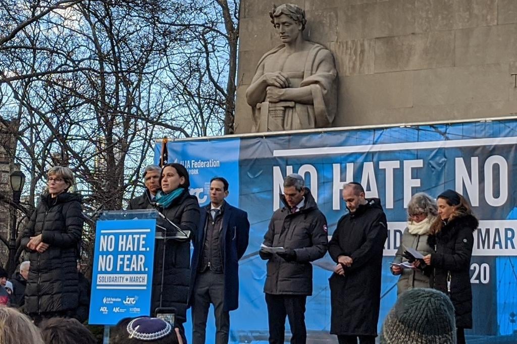 Rabbi Ashira Konigsburg reads lines from psalms.